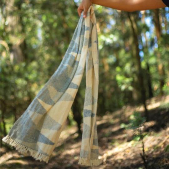 A Women holding an Indigo Scarf made from Eri Silk  - Download this silk weaving pattern today